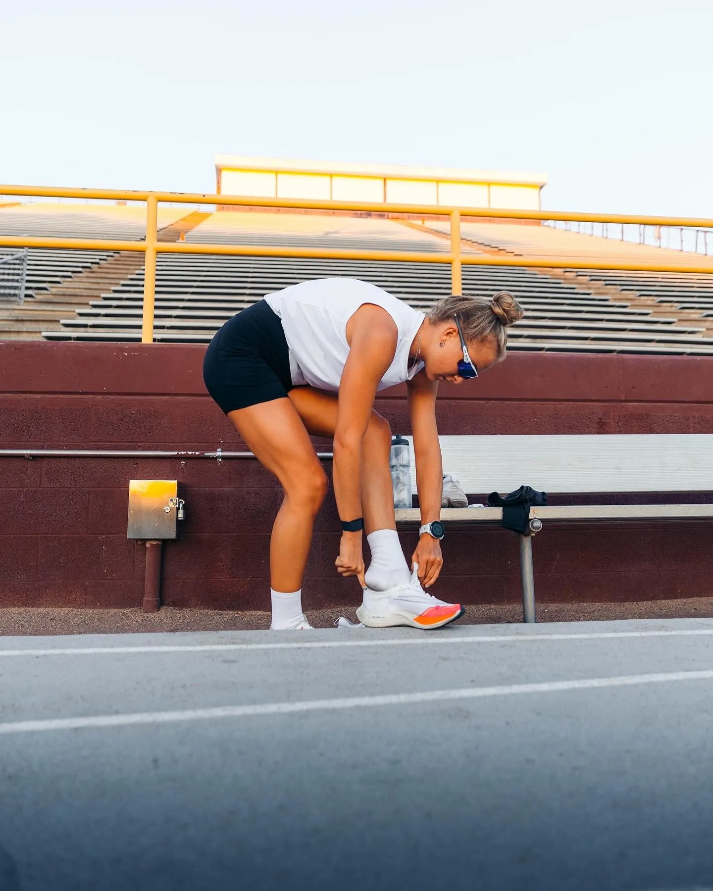 Heidi Jurankova tying her shoe before training